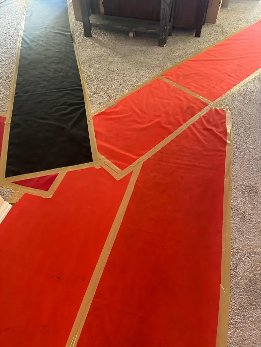 Red carpet-style floor runner protecting hallway during move