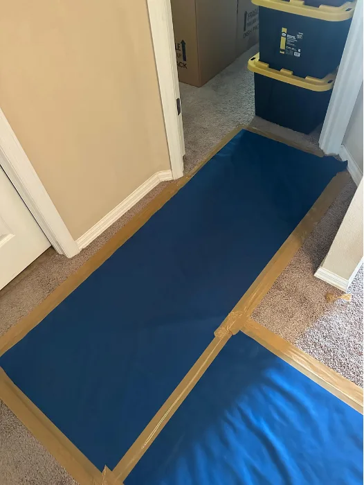 Blue padded covers on walls and door frames to prevent damage