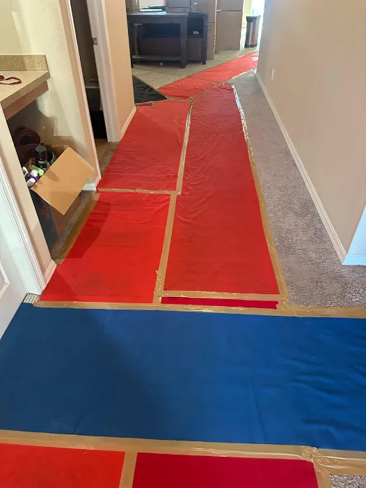 Entryway shielded with thick moving blanket and floor protection