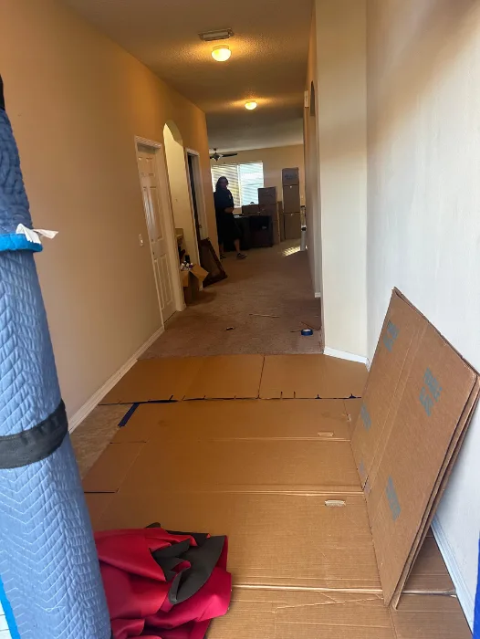 Protective floor covering placed along high-traffic areas in home