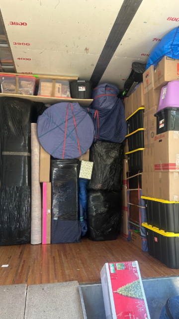 Professionally loaded moving truck with furniture wrapped and secured