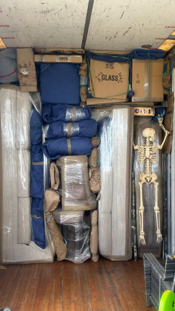 Professionally loaded moving truck with furniture wrapped and secured