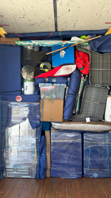 Professionally loaded moving truck with furniture wrapped and secured